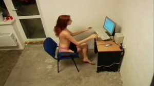 Babe is sitting naked before her PC