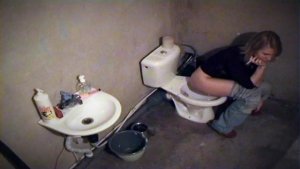 Blonde smoking in toilet with spy cam