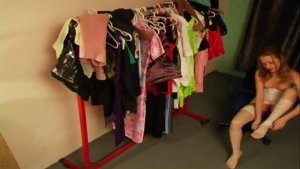 Half naked doll on fitting room spy cam