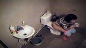 Toilet spy cam is shooting babe pissing