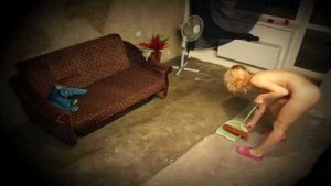 Blonde gets spied naked cleaning the room