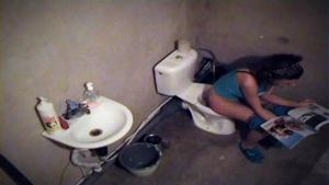 Sexy girl spied pissing on the toilet