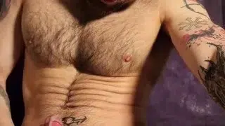 Horny tattooed hunk unloading his hairy ballsack like a bull.