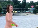 Nude beach girl is having a great time