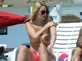 Nude beach girls casually enjoys a sunny day naked in public