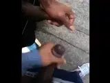Black amateurs stroke big cocks outdoors