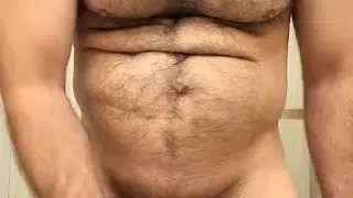 HAIRY MUSCLE BEAR PLAYING WITH NIPPLES AND STROKING COCK