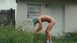 twink trimming the grass naked outside