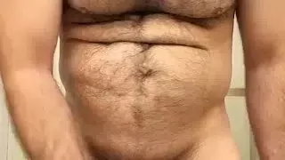 HAIRY MUSCLE BEAR PLAYING WITH NIPPLES AND STROKING COCK