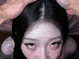 Girl with long black hair kneels for deepthroat on bedroom