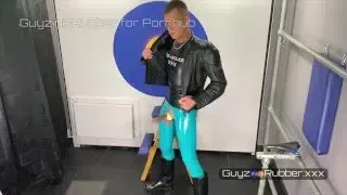 BTS of hot guy in tight rubber, boots & leather biker jacket using a fleshlight on his huge cock
